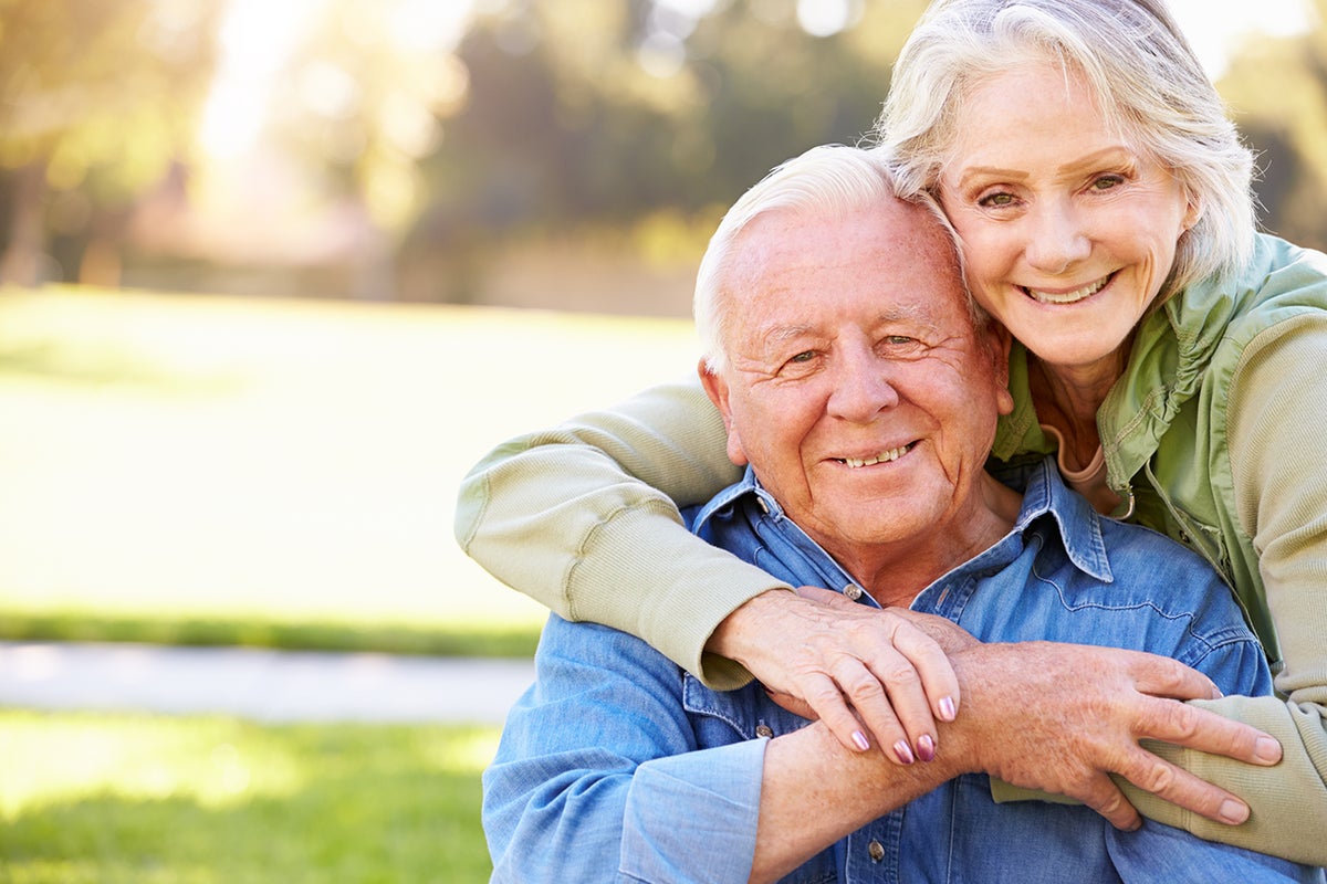 Outdoor Portrait Of Loving Senior Couple